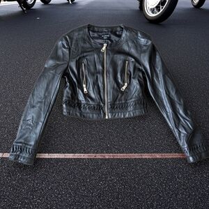 This is a Small Cropped black Bebe faux-leather jacket. 